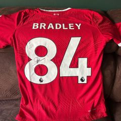 Conor Bradley signed Liverpool jersey