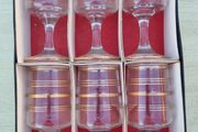 The set features six vintage vodka or liqueur glasses.