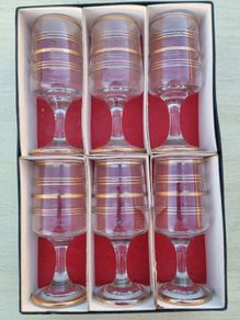 The set features six vintage vodka or liqueur glasses.