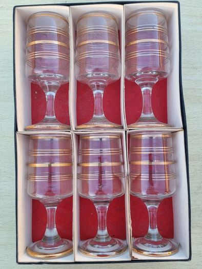 The set features six vintage vodka or liqueur glasses.
