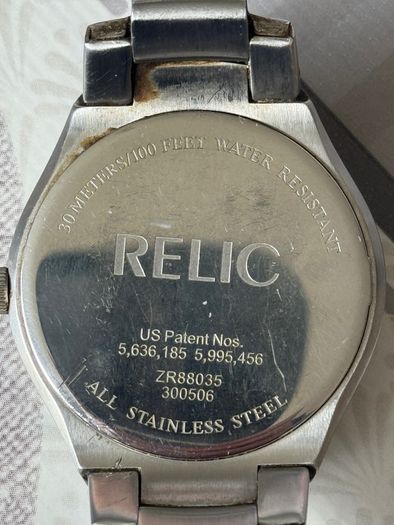 Relic face changing watch with broken watchstrap