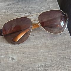 Lovely ELLE aviator sunglasses with brown tinted lenses, gold-tone metal frame and brown arms. Model EL18150, colour 719. Pre-owned condition, please see all photos for details.