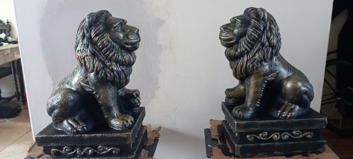 handcrafted concrete lions