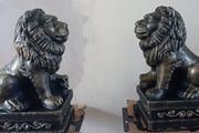 handcrafted concrete lions