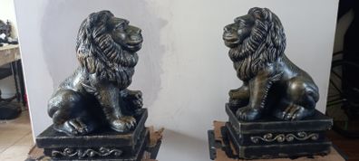 handcrafted concrete lions