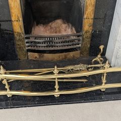 Brass fireplace fender and companion set