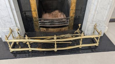 Brass fireplace fender and companion set