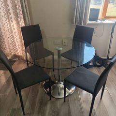 Round glass table with chairs
