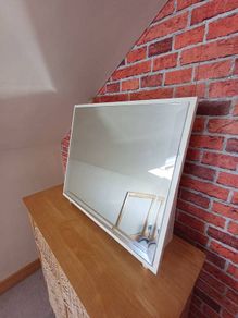 Wooden surround mirror.   Free standing