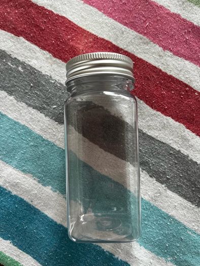 24 spice jars with labels