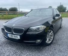 BMW 5 series, black with cream leather interior