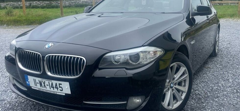 BMW 5 series, black with cream leather interior