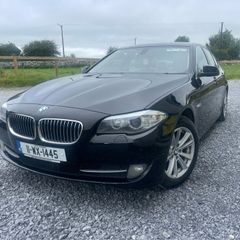 BMW 5 series, black with cream leather interior
