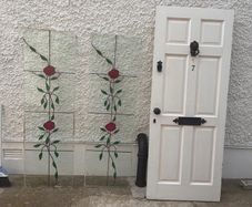 Period Style Door with Lion Head Knocker and Decorative Glass Panels