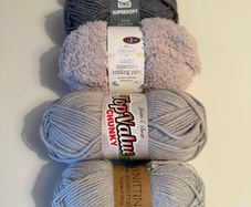 5 balls of grey yarn wool