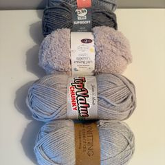 5 balls of grey yarn wool