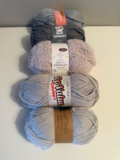 5 balls of grey yarn wool