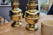 Matching pair of brass oil lamps.