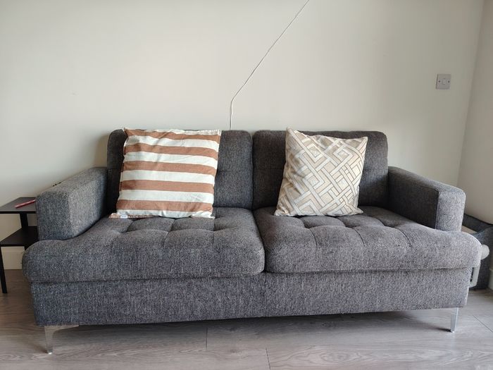 Grey two-seater sofa