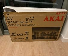 Tv with no remote (button can be used) and stand  Box included