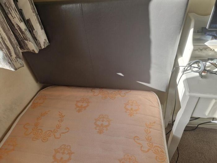 Single bed with grey headboard