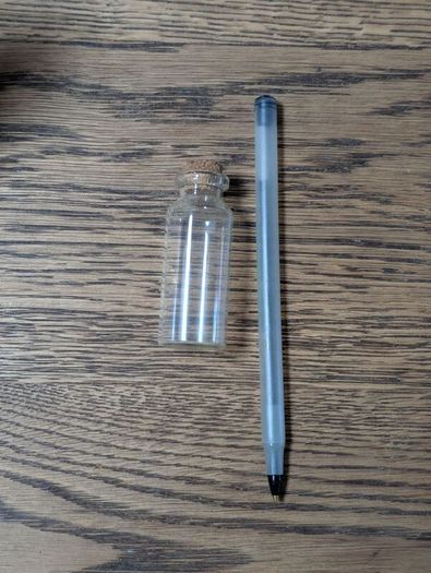 Wooden box with vials and paperbags