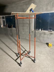 Height adjustable plastering stands