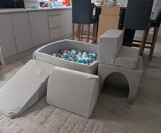 Soft foam ball pit with activity pieces