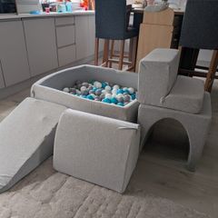 Soft foam ball pit with activity pieces