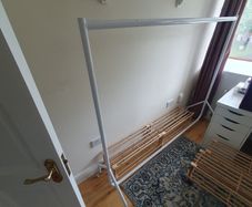 Two Clothes Rails and Four Wooden Shoe Racks