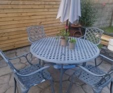 cast iron table and 4 chairs