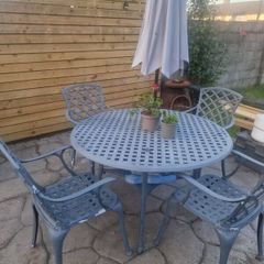 cast iron table and 4 chairs