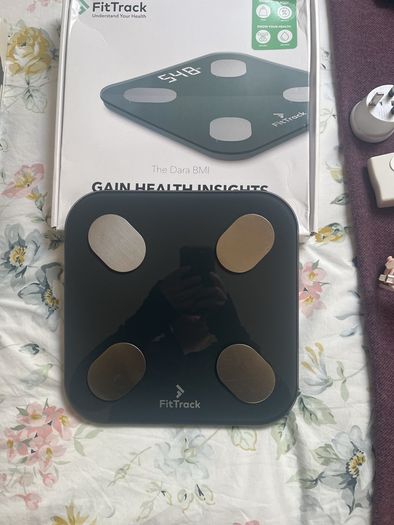 weighing scales FitBit and FitTrack