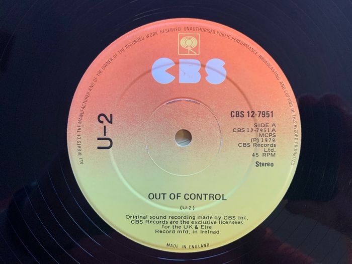U2 - "Three" - 12" Vinyl  from 1979 - CBS 12-7951 - Second Release - Plain Black Sleeve, CBS Sunburst Labels