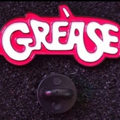 Grease, pin back badge.
