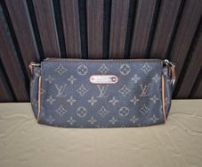 Louis vuitton vintage eva clutch
