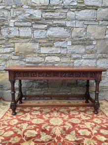 Early 20th Century Jacobean Revival Carved Oak hall table.