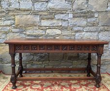 Early 20th Century Jacobean Revival Carved Oak hall table.