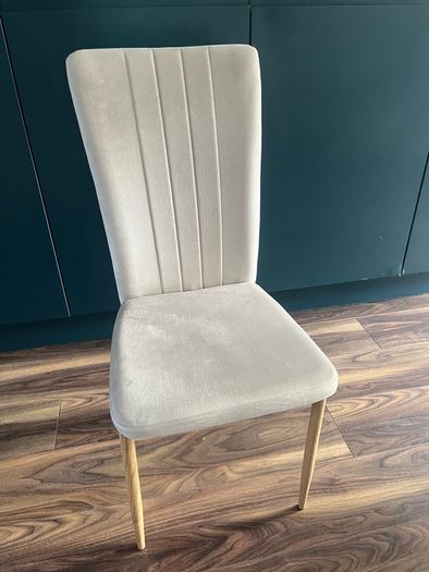 4 beige dining chairs and 2 counter stools