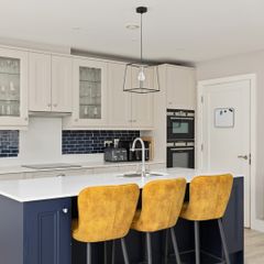 Three mustard yellow high stools