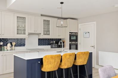 Three mustard yellow high stools