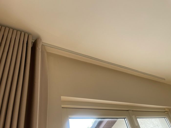 Wave fold curtain and slim line ceiling track