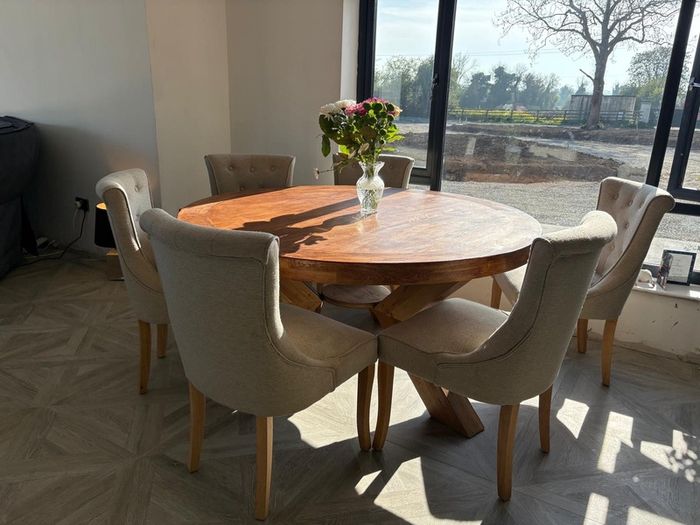 Solid oak dining table and six chairs