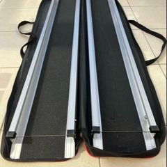 Telescopic channel ramps 7ft (213cm long) for a wheelchair with black grip surface and bag