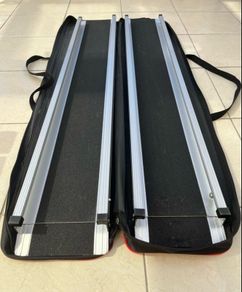 Telescopic channel ramps 7ft (213cm long) for a wheelchair with black grip surface and bag