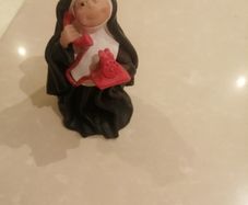Sister folk figurine Nun on phone