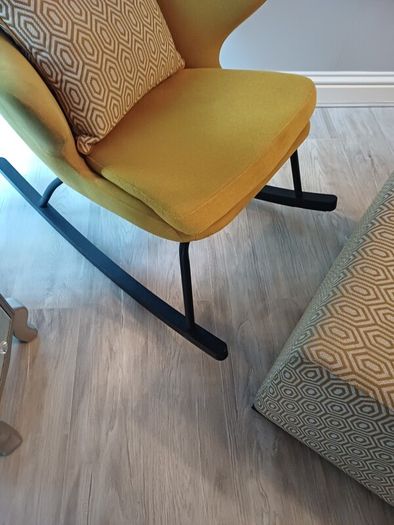 Rocking accent chair designer Kare with matching foot stool