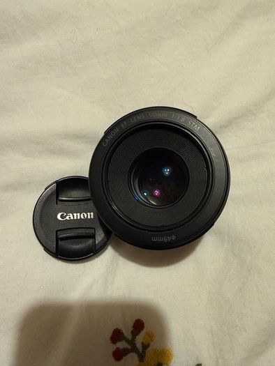 Canon EOS 250D DSLR Camera with + 50mm lens +18-135mm lens + and selfie tripod.