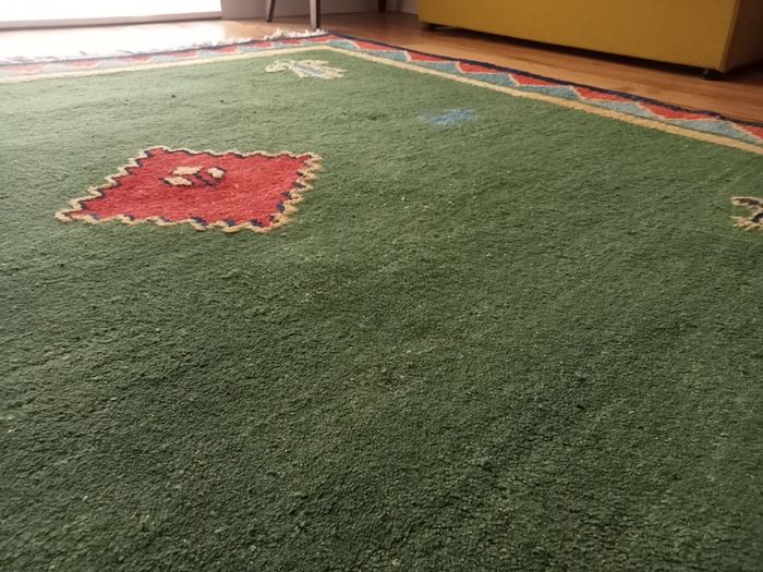 hand-knotted green Gabbeh rug