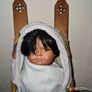 Vintage Native American baby on a sled porcelain doll Image 2